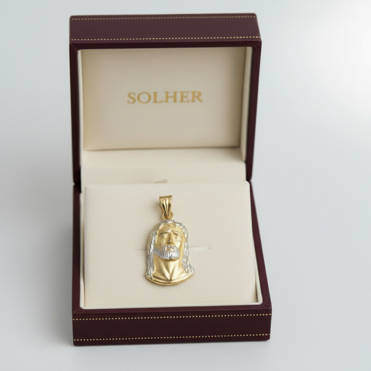 Colgante con el rostro de cristo bicolor en Oro de 18 Kl. Sin forrar por la parte posterior.