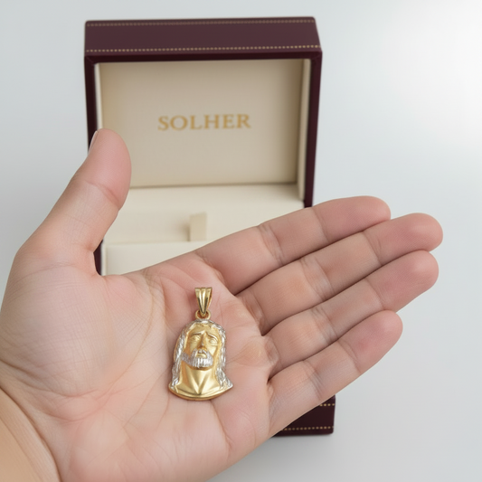 Colgante con el rostro de cristo bicolor en Oro de 18 Kl. Sin forrar por la parte posterior.