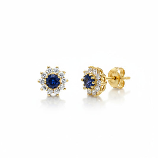 Pendientes en 100%  Oro de 18 Kl. con circonitas y piedra central en crisopal azul. 8 mm.