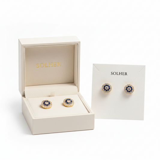 Pendientes redondos en 100% Oro de 18 Kl. con circonitas y crisopal azul.  Cierre de presión.  7mm.