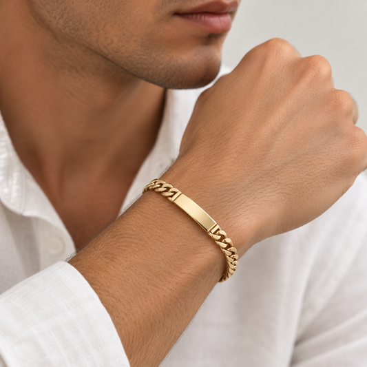 Pulsera hueca en 100% Oro de 18 Kl. con placa. Eslabón barbado.