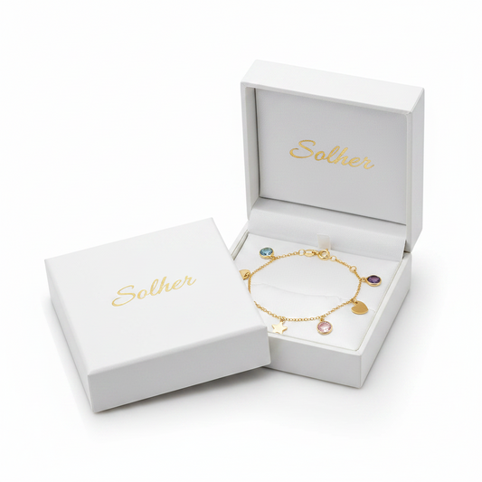 Pulsera mini charms   100% en Oro 18 Kl. con diferentes motivos: círculos, estrella y corazón + 4 piedras