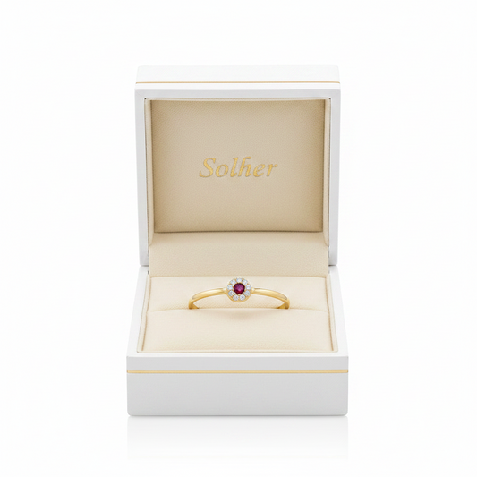Sortija Hecho 100% en Oro de 18 Kl. con circonitas y piedra central en crisopal rojo.